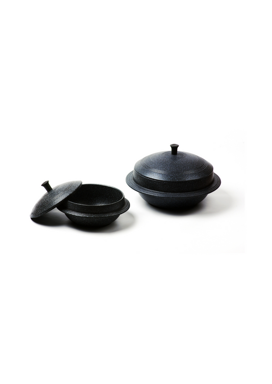 Tasty rice in a traditional cauldron rice pot